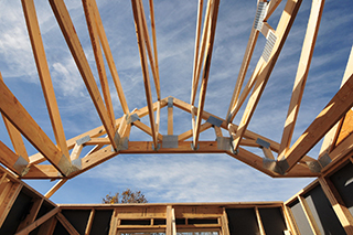 Skyward view of a roof truss and attached components